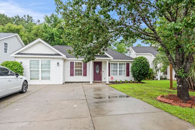 View of front of home with a front yard, roof with shingles, and driveway | Image 29