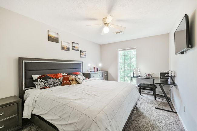 The secondary bedrooms are generously sized--this is a king size bed! | Image 16