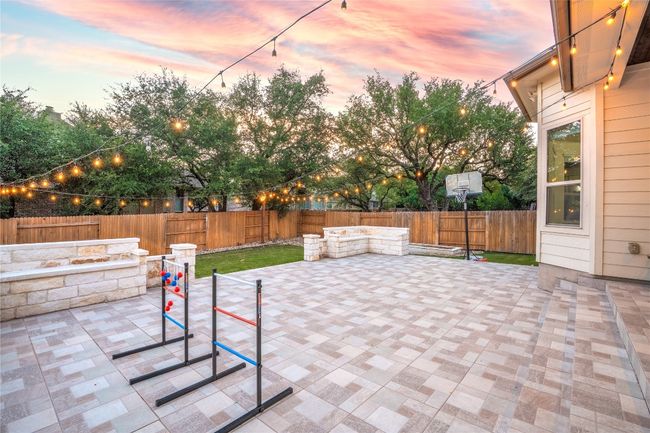 Patio terrace at dusk featuring a patio area and a fenced backyard | Image 36