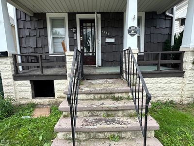 View of exterior entry with covered porch | Image 2