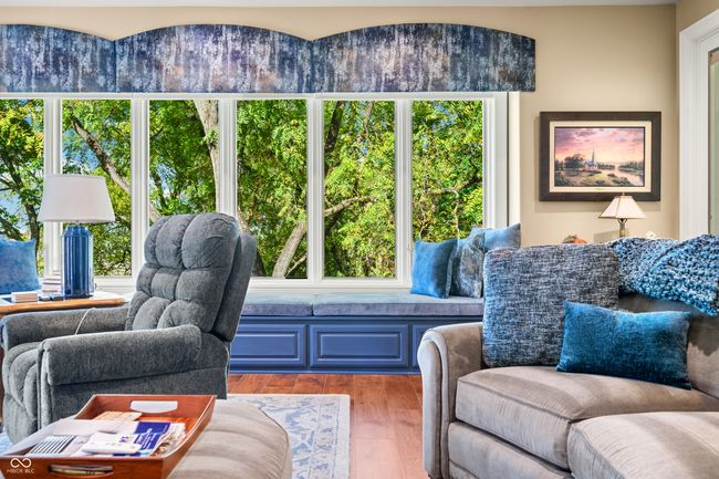 living area with wood finished floors and a healthy amount of sunlight | Image 19