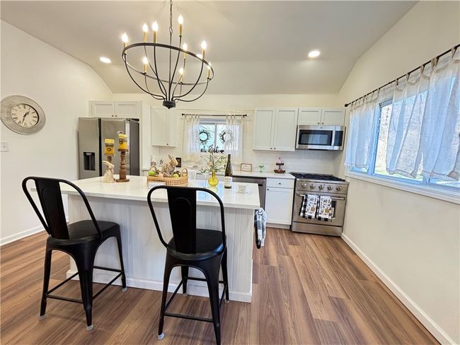 Quartz counters , built in usb charging port , custom chandelier | Image 24