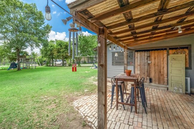 View of green lawn with a patio | Image 35