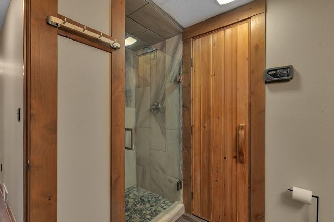 Tiled shower off the spa | Image 32