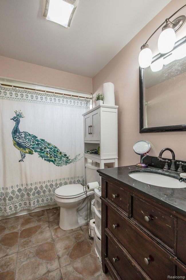 Pretty full bath with granite vanity and tile flooring | Image 15