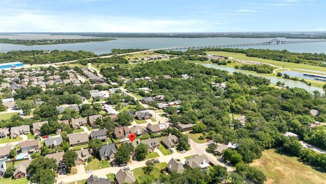 Aerial view of residential area with a notable bridge and a nearby body of water | Image 4
