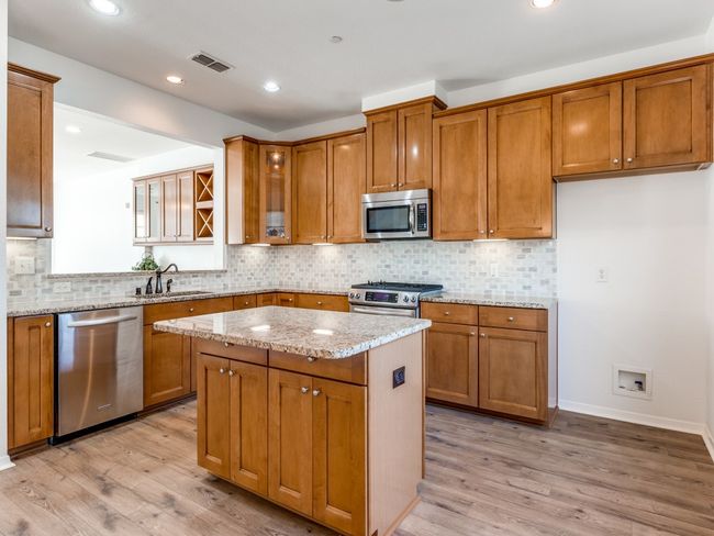 2nd Level Kitchen with plenty of storage & center Island | Image 7