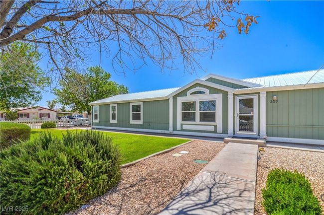 View of front of house with metal roof | Image 4