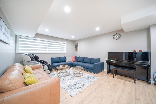 Living area with baseboards, wood finished floors, and recessed lighting | Image 24