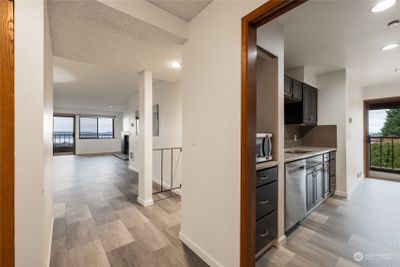 Kitchen on right dining and living room on left. | Image 3