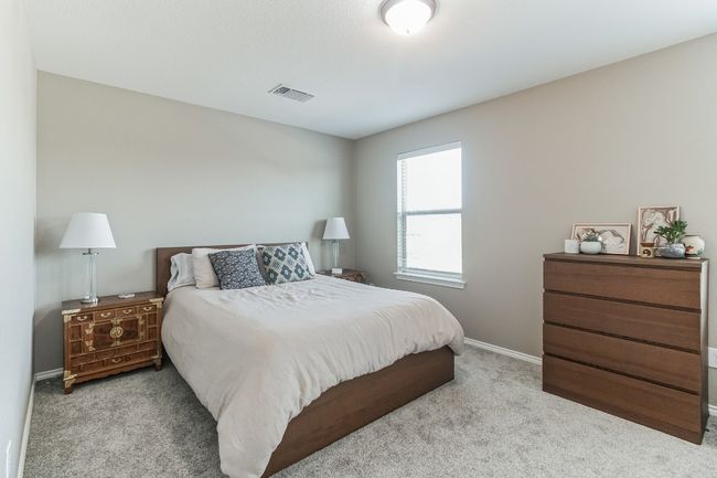 Carpeted bedroom with baseboards | Image 24