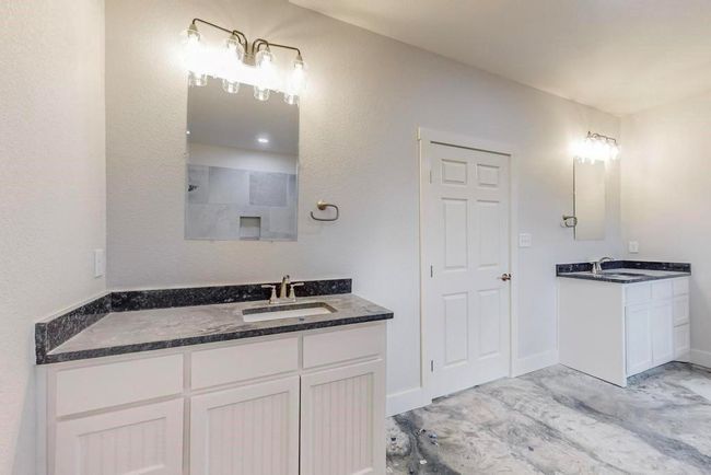 Bathroom with a shower, two vanities, and a sink | Image 18