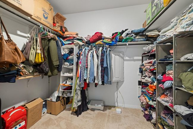 Spacious closet with carpet floors | Image 17