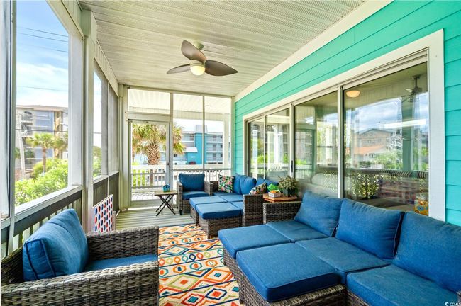 Sunroom / solarium with outdoor lounge area and a ceiling fan | Image 11
