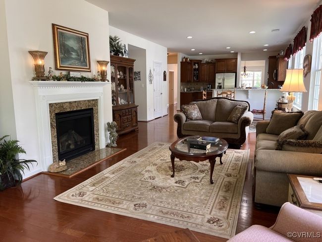 Living room with a fireplace and dark hardwood / wood-style floors | Image 27