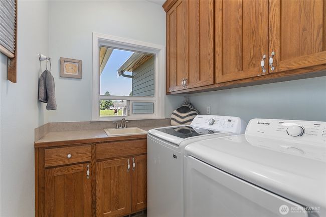 Laundry on main level with utility sink. Can be modified into a full bath on the primary level. | Image 26