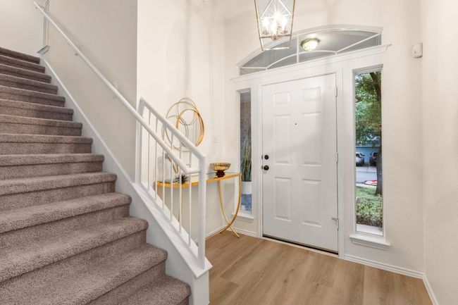 The home has been freshly painted and had a mini make over. There is brand new LVP flooring that is durable and ready for your four legged babies or your human babies! | Image 5