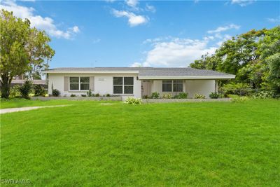 Ranch-style home featuring a front lawn | Image 1