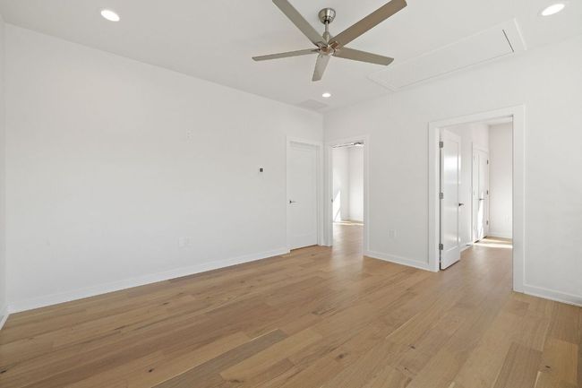 Spare room with attic access, recessed lighting, and light wood floors | Image 21