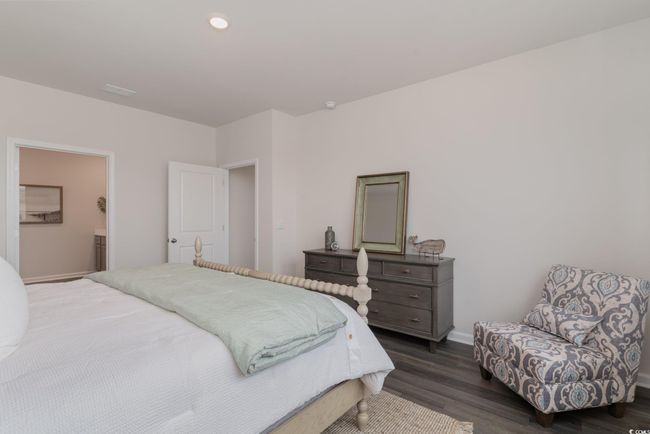 Bedroom featuring dark wood-style floors and recessed lighting | Image 16