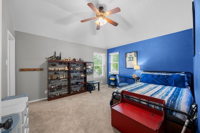 Secondary bedroom featuring walk in closet | Image 29