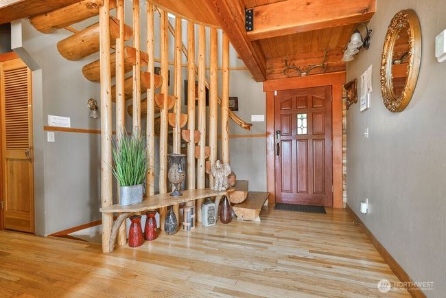 Entry Hall and gorgeous log spiral staircase. | Image 5
