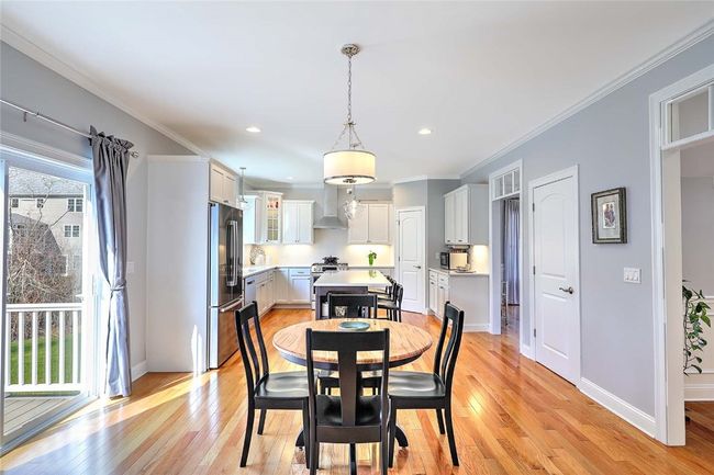 Dining area looking into Family Room | Image 16
