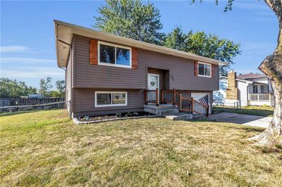 Split foyer home featuring a front lawn | Image 1