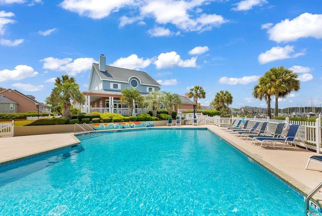 Pool with fence and a patio | Image 37
