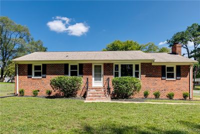 Single story home featuring a front yard | Image 1