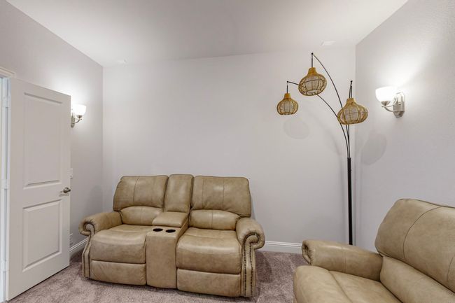Sitting room with light colored carpet and baseboards | Image 32