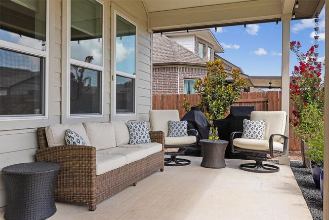 View of extended covered patio / terrace with outdoor ceiling fans | Image 25