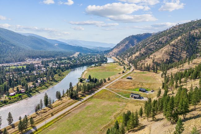 Aerial view of sparsely populated area featuring a water and mountain view | Image 43