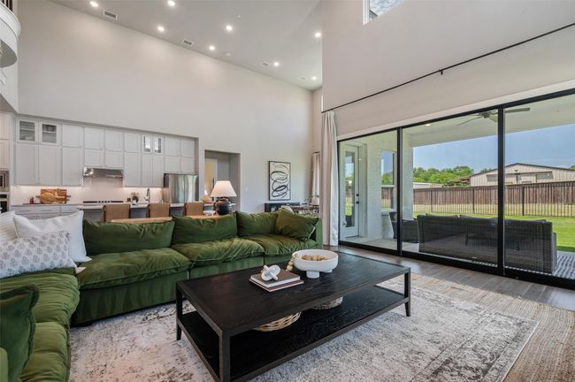 Wall of windows that slide open creating an amazing indoor outdoor space for entertaining. | Image 6