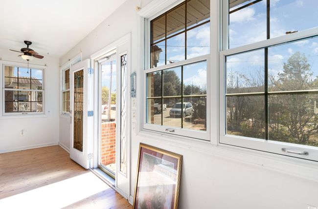 Doorway to outside featuring ceiling fan and light hardwood / wood-style flooring | Image 24