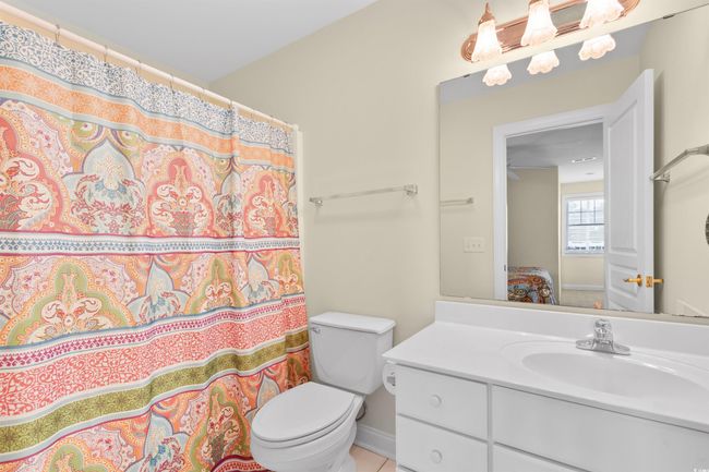 Full bath featuring vanity, toilet, baseboards, and a shower with shower curtain | Image 20