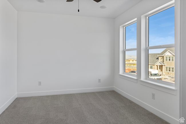 Unfurnished room featuring ceiling fan, carpet flooring, and baseboards | Image 18