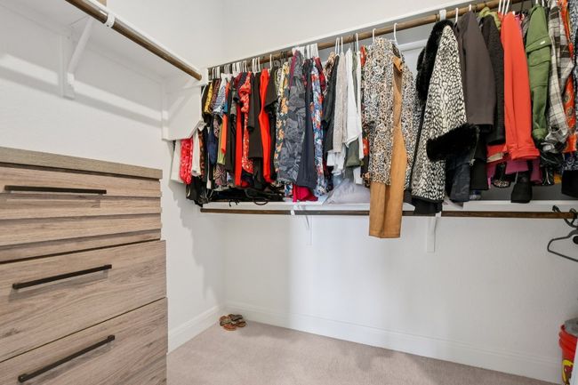 Spacious closet featuring carpet flooring | Image 17