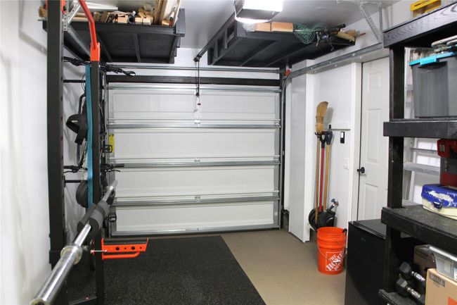Garage featuring a garage door opener | Image 22