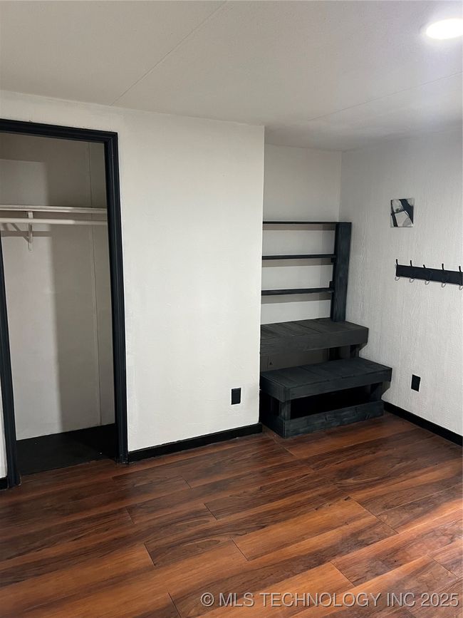 Unfurnished bedroom featuring wood finished floors and baseboards | Image 23