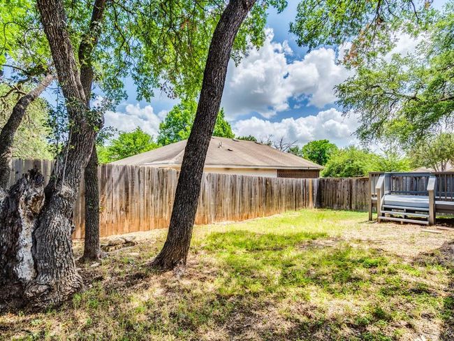 Fenced backyard featuring a deck | Image 29