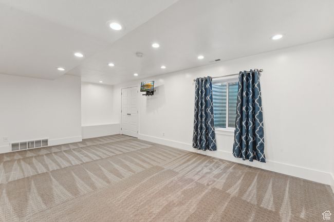Carpeted empty room with recessed lighting and baseboards | Image 24