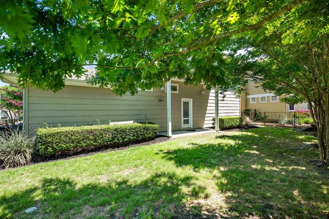 Rear view of property with a yard and fence | Image 31