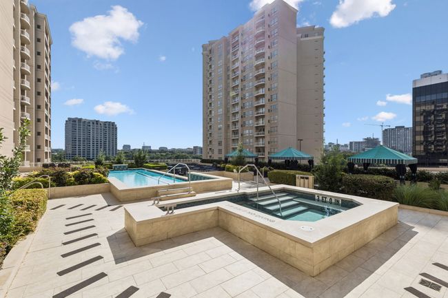 Community pool with a community hot tub, a view of city, and a patio area | Image 7