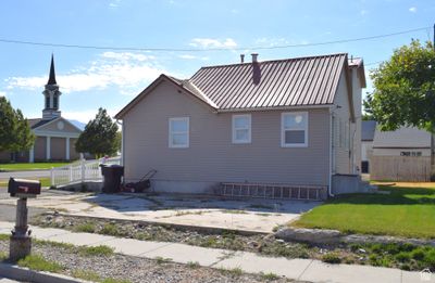 View of home's exterior with a lawn and a patio area | Image 3