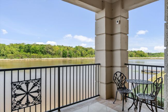 Balcony featuring a water view and a forest view | Image 21