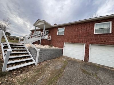 View of home's exterior with a garage | Image 2