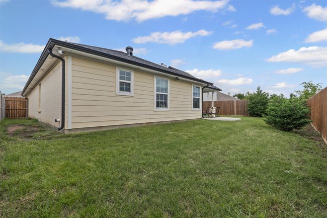 Rear view of house with a patio | Image 27