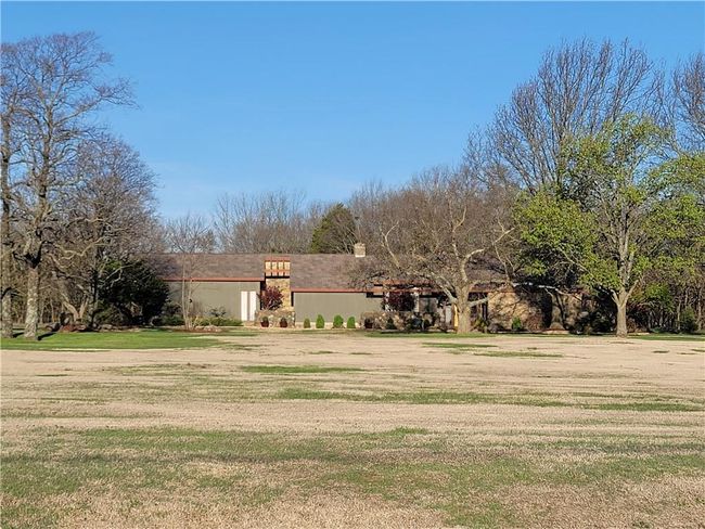 View of front of property with a front lawn and a chimney | Image 75