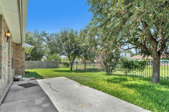 Fenced backyard featuring a patio | Image 29
